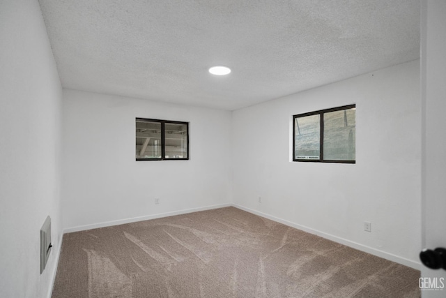 24501 Pueblo Ct, Tehachapi, CA 93561 - carpeted empty room featuring a textured ceiling and recessed lighting