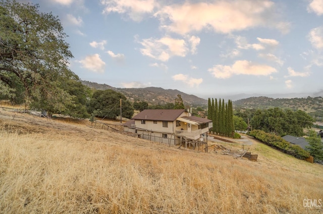24501 Pueblo Ct, Tehachapi, CA 93561 - rear view of property with a rural view, a deck with mountain view, and stairway