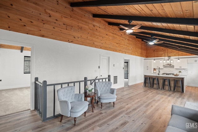 24501 Pueblo Ct, Tehachapi, CA 93561 - living room featuring a wood ceiling with exposed beams, a ceiling fan, high vaulted ceiling, and light wood-style flooring