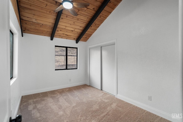 24501 Pueblo Ct, Tehachapi, CA 93561 - unfurnished bedroom featuring a wood ceiling with exposed beams, carpet, a closet, a ceiling fan, and high vaulted ceiling