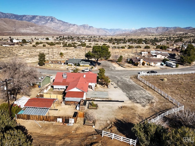 birds eye view of property with a mountain view