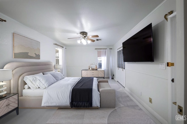 bedroom featuring visible vents, ceiling fan, and baseboards