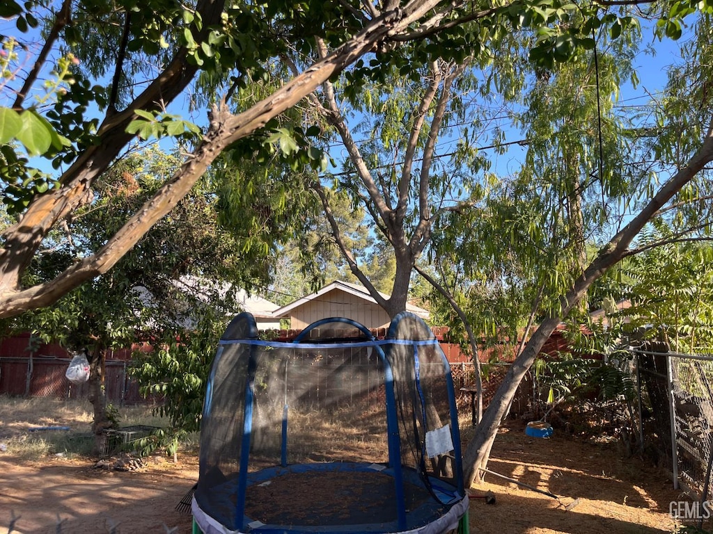 3325 Monterey St, Bakersfield, CA 93306 - view of yard featuring a trampoline