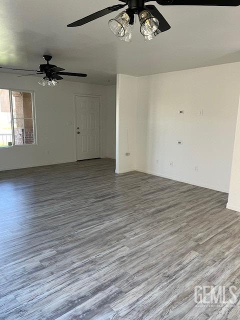 interior space with hardwood / wood-style floors and ceiling fan