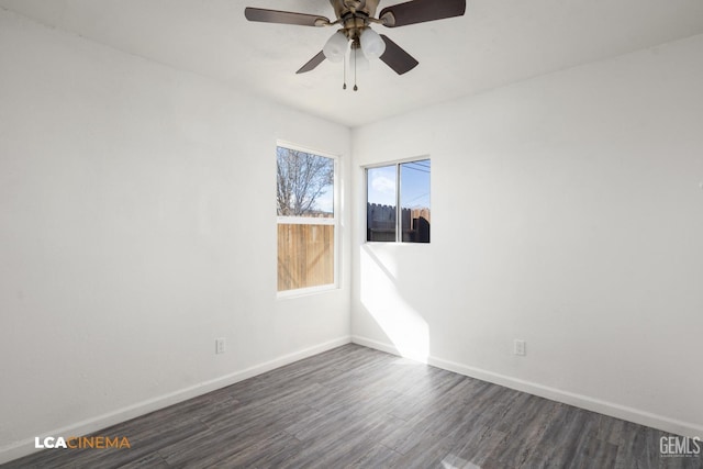 empty room featuring ceiling fan and dark hardwood / wood-style flooring