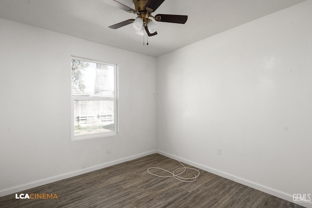 spare room with ceiling fan and dark hardwood / wood-style flooring