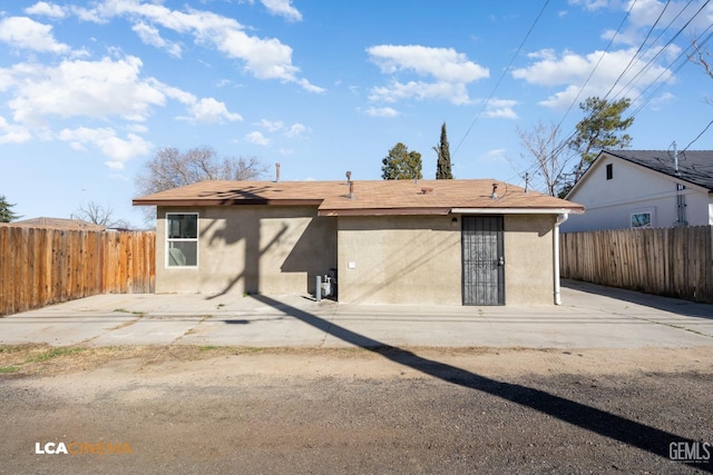 back of house with a patio