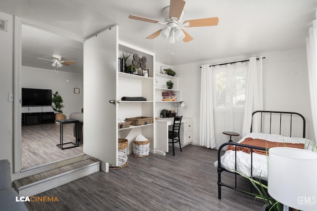 bedroom featuring ceiling fan and dark hardwood / wood-style floors