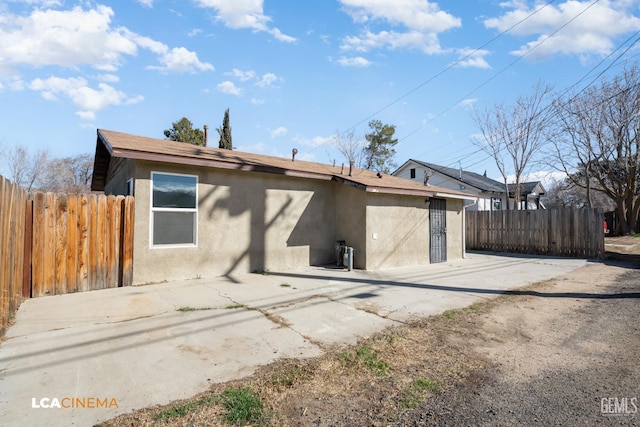 rear view of property featuring a patio area