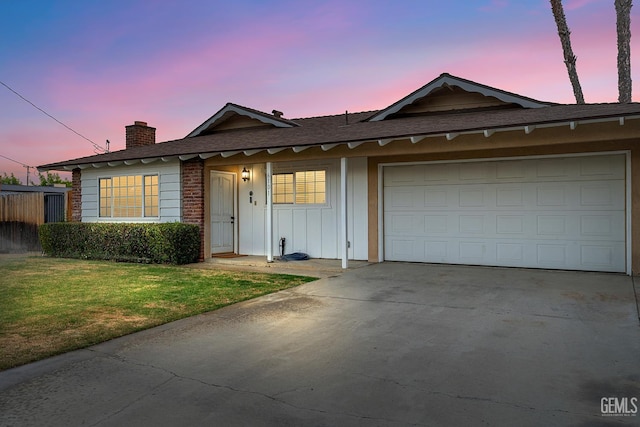 6101 Crestmore St, Bakersfield, CA 93308 - single story home featuring concrete driveway, a garage, a chimney, board and batten siding, and a front yard