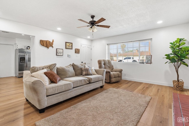 6101 Crestmore St, Bakersfield, CA 93308 - living area with ceiling fan, recessed lighting, light wood-style flooring, and a textured ceiling
