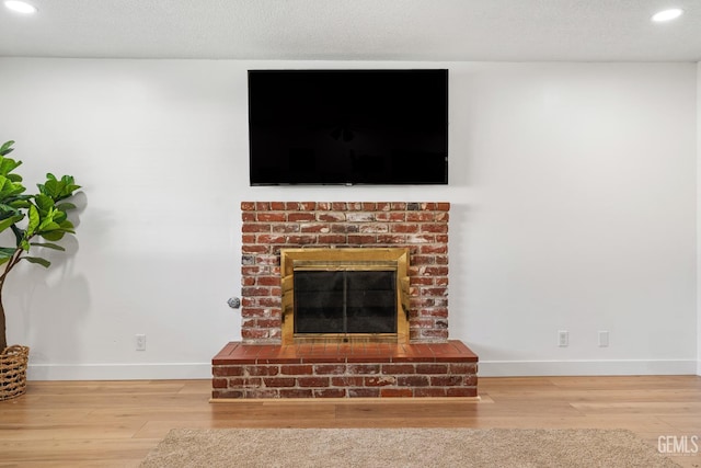 6101 Crestmore St, Bakersfield, CA 93308 - detailed view of wood finished floors, recessed lighting, and a fireplace