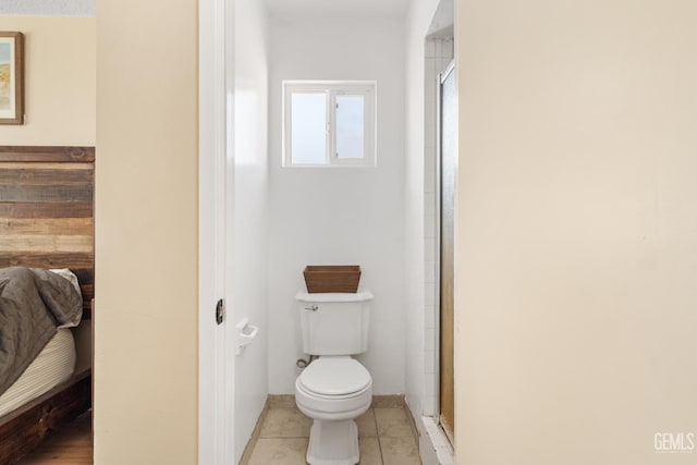 6101 Crestmore St, Bakersfield, CA 93308 - ensuite bathroom with a shower stall and tile patterned floors