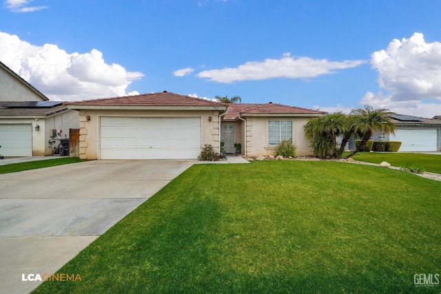 single story home with a garage and a front lawn