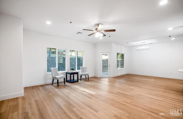 18671 Buckeye Pl, Tehachapi, CA 93561 - spare room featuring recessed lighting, light wood finished floors, a chandelier, and a ceiling fan
