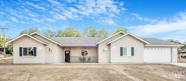 18671 Buckeye Pl, Tehachapi, CA 93561 - ranch-style home featuring a garage, concrete driveway, stucco siding, and a porch