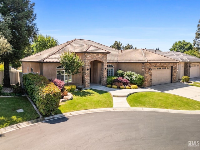 9005 Via Lugano, Bakersfield, CA 93312 - mediterranean / spanish-style home with stone siding, a tiled roof, driveway, an attached garage, and stucco siding