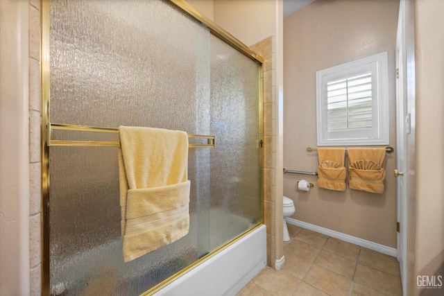 9005 Via Lugano, Bakersfield, CA 93312 - bathroom featuring tile patterned flooring, toilet, baseboards, and shower / bath combination with glass door