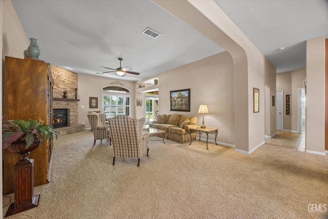9005 Via Lugano, Bakersfield, CA 93312 - living area featuring light carpet, a fireplace, a ceiling fan, and baseboards
