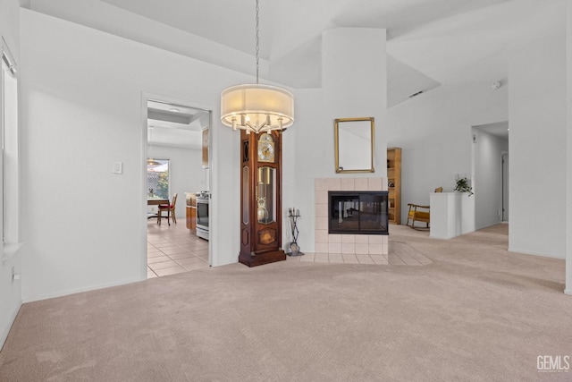 10400 Walnut Creek Ct, Bakersfield, CA 93311 - tiled living room with carpet floors, a tile fireplace, and high vaulted ceiling