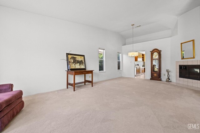 10400 Walnut Creek Ct, Bakersfield, CA 93311 - carpeted living area with a fireplace and high vaulted ceiling