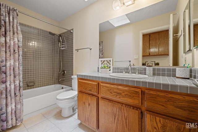 10400 Walnut Creek Ct, Bakersfield, CA 93311 - bathroom with tile patterned floors, toilet, shower / tub combo, vanity, and a skylight