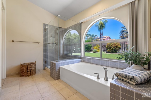 10400 Walnut Creek Ct, Bakersfield, CA 93311 - full bathroom with tile patterned flooring, tiled shower, a garden tub, and vaulted ceiling