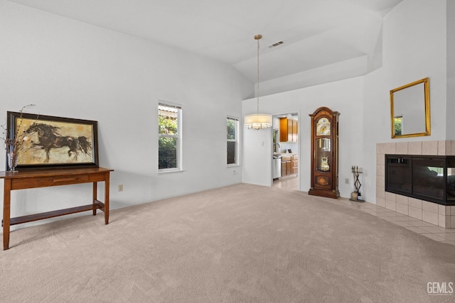 10400 Walnut Creek Ct, Bakersfield, CA 93311 - unfurnished living room featuring carpet floors, a fireplace, a chandelier, and high vaulted ceiling