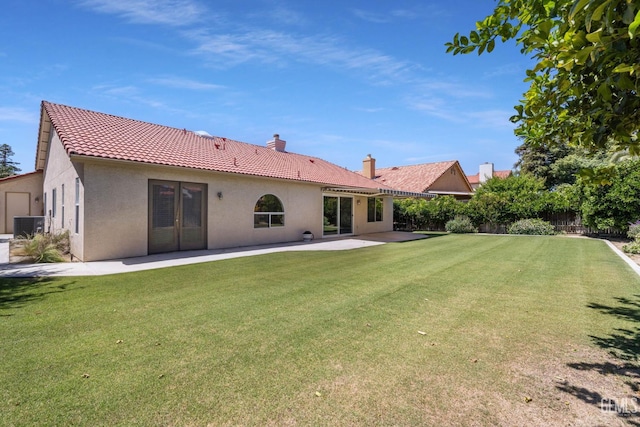 10400 Walnut Creek Ct, Bakersfield, CA 93311 - back of property featuring stucco siding, a chimney, a patio area, a tiled roof, and cooling unit