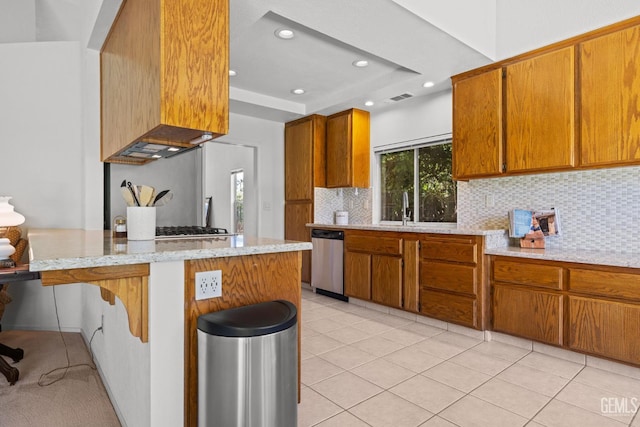 10400 Walnut Creek Ct, Bakersfield, CA 93311 - kitchen featuring stainless steel dishwasher, a sink, brown cabinetry, decorative backsplash, and recessed lighting
