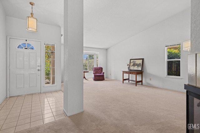 10400 Walnut Creek Ct, Bakersfield, CA 93311 - foyer entrance with light colored carpet, light tile patterned floors, and high vaulted ceiling