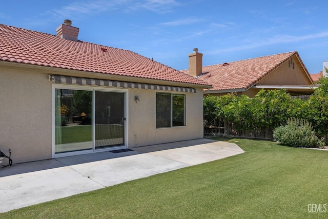 10400 Walnut Creek Ct, Bakersfield, CA 93311 - back of house featuring stucco siding, a patio, a tiled roof, and a chimney