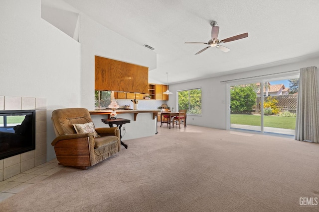 10400 Walnut Creek Ct, Bakersfield, CA 93311 - sitting room with light colored carpet, vaulted ceiling, and ceiling fan