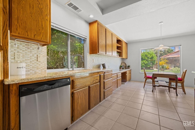 10400 Walnut Creek Ct, Bakersfield, CA 93311 - kitchen with stainless steel dishwasher, backsplash, a sink, brown cabinets, and light tile patterned flooring