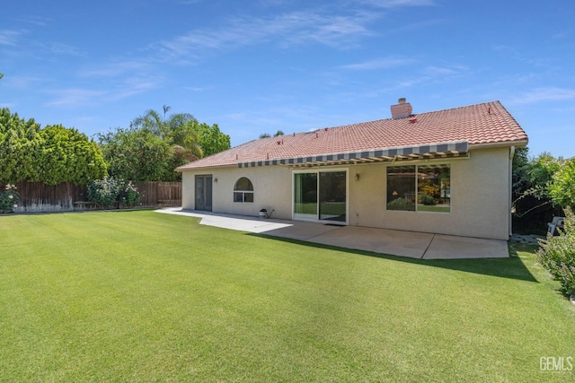 10400 Walnut Creek Ct, Bakersfield, CA 93311 - rear view of house featuring a tiled roof, a chimney, a patio area, and stucco siding
