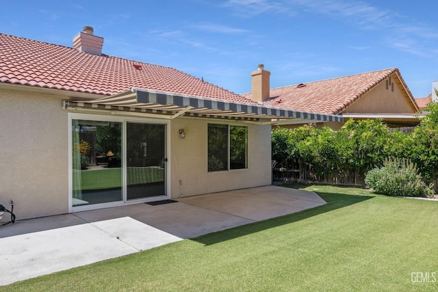 10400 Walnut Creek Ct, Bakersfield, CA 93311 - back of property with stucco siding, a patio area, a chimney, and a tiled roof