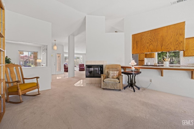 10400 Walnut Creek Ct, Bakersfield, CA 93311 - living area featuring carpet floors, a fireplace, and a high ceiling