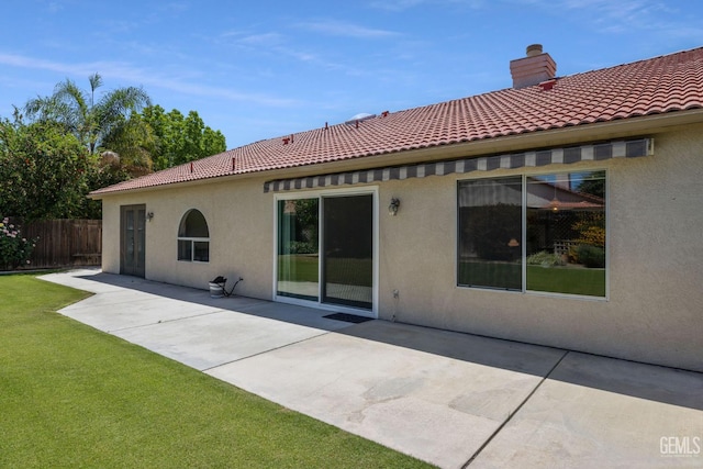 10400 Walnut Creek Ct, Bakersfield, CA 93311 - back of property with stucco siding, a chimney, a patio area, and a tile roof