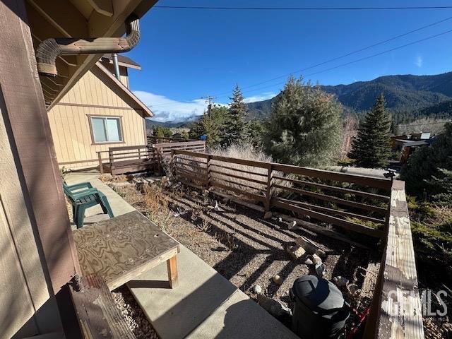 exterior space featuring a mountain view and a balcony