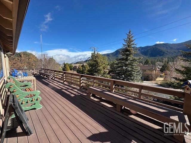 wooden terrace with a mountain view