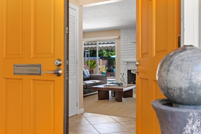 2924 Elm St, Bakersfield, CA 93301 - entrance foyer featuring light tile patterned floors and a textured ceiling