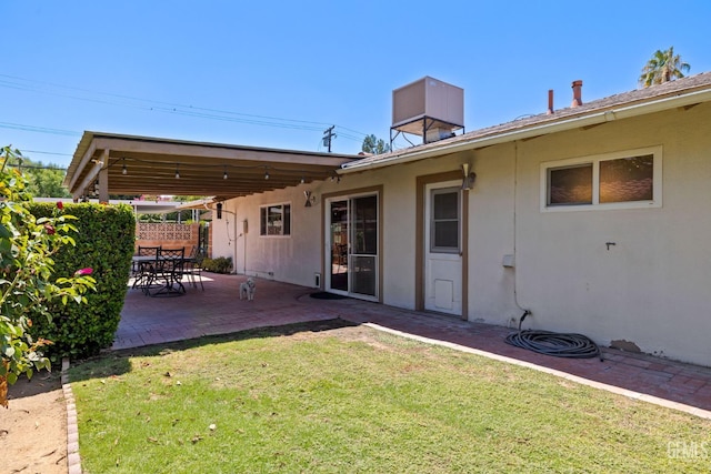 2924 Elm St, Bakersfield, CA 93301 - rear view of house featuring stucco siding and a patio