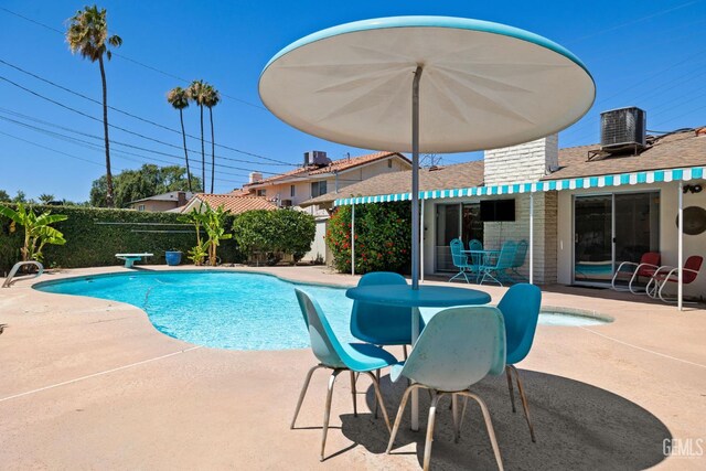 2924 Elm St, Bakersfield, CA 93301 - view of swimming pool with a patio area and a fenced backyard