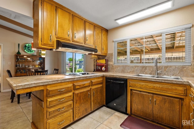 2924 Elm St, Bakersfield, CA 93301 - kitchen with dishwasher, brown cabinetry, a peninsula, and light tile patterned floors