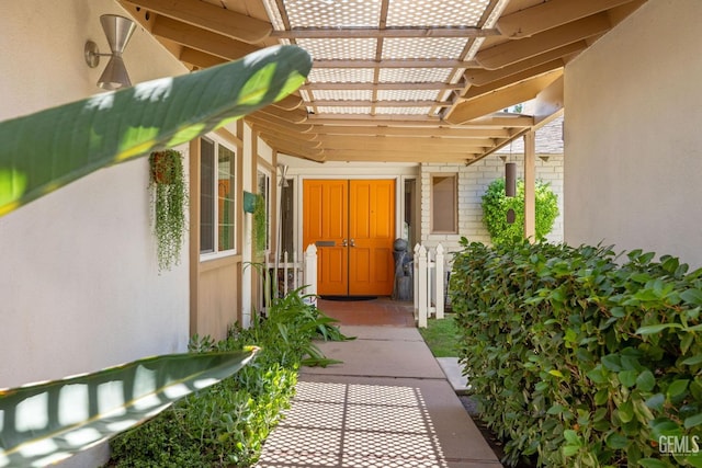 2924 Elm St, Bakersfield, CA 93301 - property entrance featuring stucco siding, a pergola, and brick siding