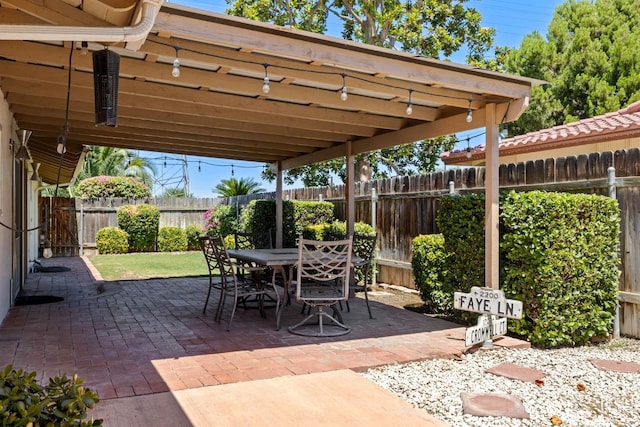 2924 Elm St, Bakersfield, CA 93301 - fenced backyard featuring a patio area and outdoor dining area