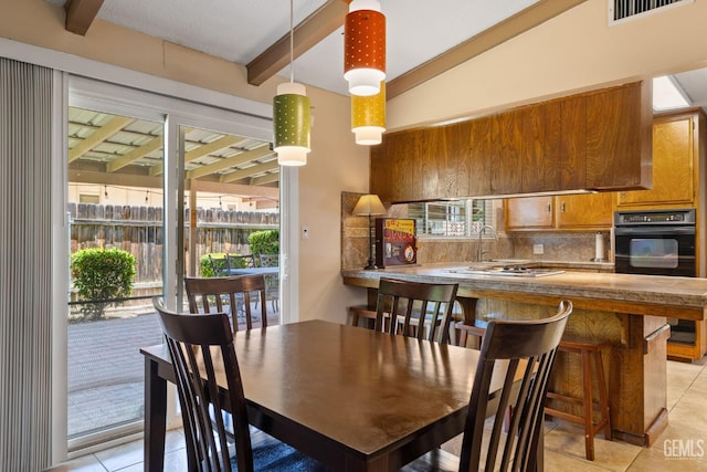 2924 Elm St, Bakersfield, CA 93301 - dining area featuring light tile patterned floors