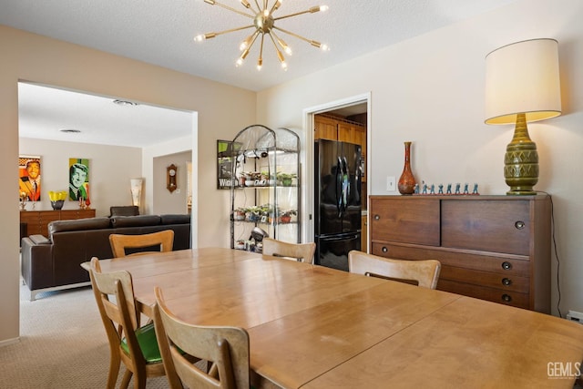 2924 Elm St, Bakersfield, CA 93301 - dining space featuring a chandelier and carpet floors