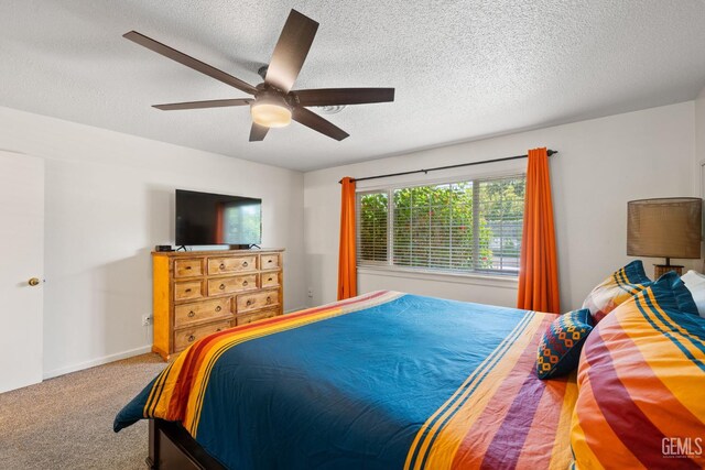 2924 Elm St, Bakersfield, CA 93301 - carpeted bedroom featuring a textured ceiling and ceiling fan