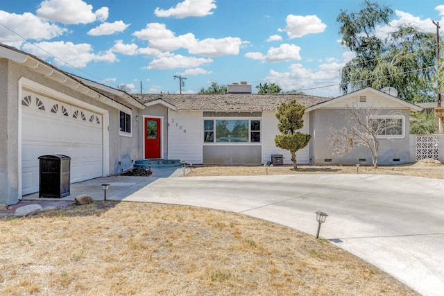 single story home featuring a garage